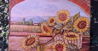 Canestro di girasoli su balcone e paesaggio